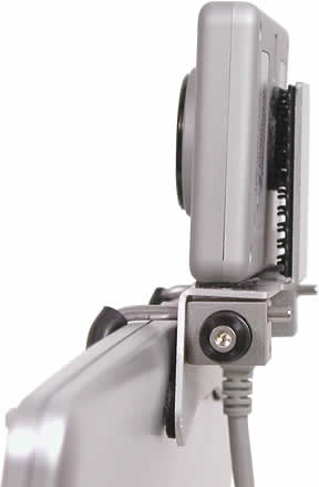 Side view of a HeadMouse Extreme and mounting bracket on a notebook computer.