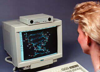 Person at computer using a head tracking sensor.
